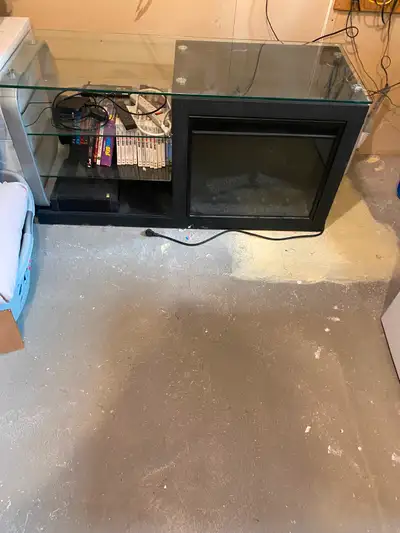 Entertainment unit with fireplace. Dimensions are 52 inches in length, 25 inches wide and 20 inches...