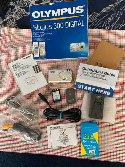 Olympus Stylus 300 3.2 MP Digital Camera with 3X Optical Zoom In the Box https://www.facebook.com/ma...