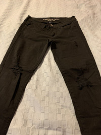 American eagle black jeans, size 8 with knee slits