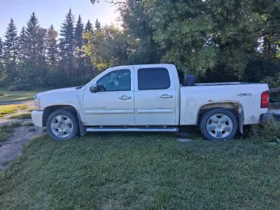 2010 Chevy Silverado 1500 LTZ. It's got a crew cab, leather interior, spray in belligerent, has 4 wh...