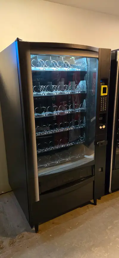Crane 167 Millenia curved front snack vending machine. Fully refurbished. Two available. 3650 each w...