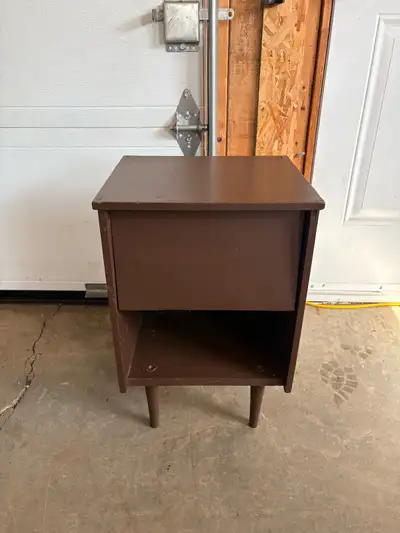 Compact mid-century style nightstand or end table with tapered legs. Great size for beside a bed, sm...