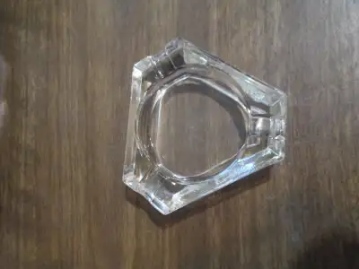 small triangular glass ashtray., View more