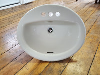 Foremost Porcelain oval sink with new drain, gasket, tail pipe