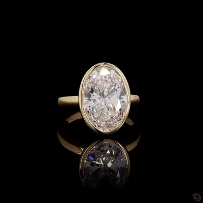 Timeless and modern, this stunning engagement ring features a brilliant 3.00 carat oval lab-grown di...
