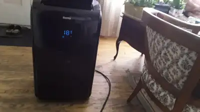 15 000 B T U Portable Air conditioner/on rollers almost new, View more