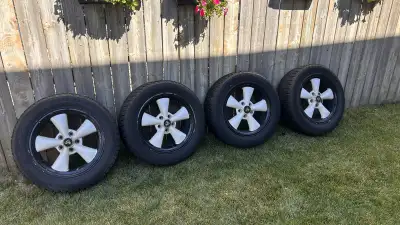 Lots of tread left - 4 blizzak Tires and Mustang rims Bolt Pattern: 5x 114.3