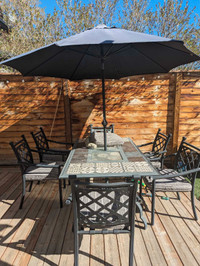 Patio table chairs and umbrella 