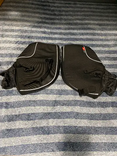 GIVI motorcycle hand protectors. Brand new. A little too small for my hands. Comes with storage bag.