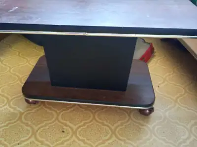 Heavy duty and from the 80s. Can hold any modern TV no problem. Rolls around easy. Ogden