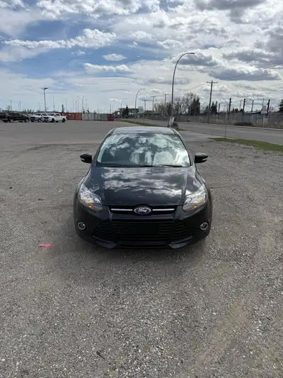 2014 Ford Focus Titanium with two sets of tires. Only one owner, 135,983 km. Black Exterior / Black...