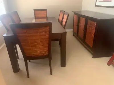 Dining room table, chairs and credenza with dark walnut stain and inset bamboo. Table has glass inse...