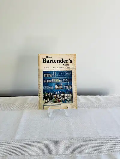 Immerse yourself in the art of mixology with the vintage "Home Bartender's Guide Soft Cover-Revised...