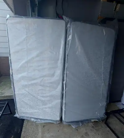 Two brand new twin size mattress, $30 each; Two twin bed frame, great condition $30 each; a set of m...