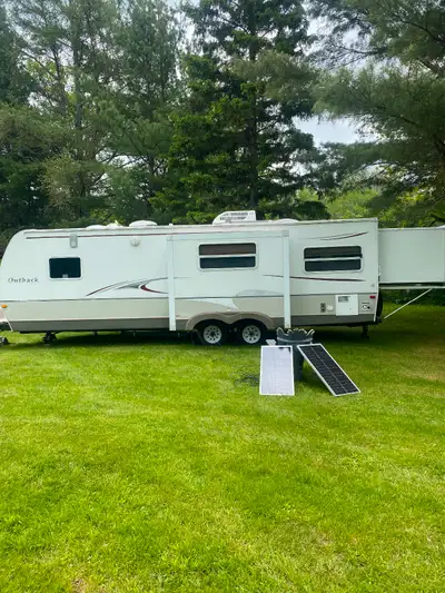 Full size toy hauler. Relatively lightweight (aluminum framing). A little scruffy. Has solar panels,...