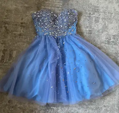 Step into the spotlight with this dazzling JADORE Evening short, periwinkle prom dress, perfect for...