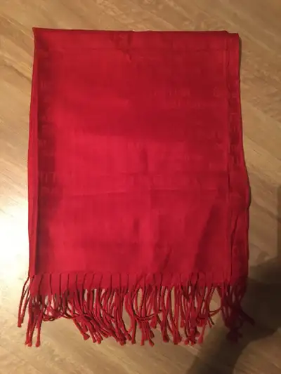 Red woven scarf. Features a repeating Louis Vuitton-inspired pattern. Fringe trim. Lightweight. Bran...