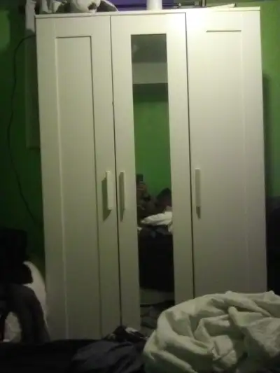 Large Armoire, 3 long doors open with a mirror on one., View more