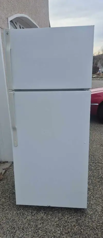 GE fridge with top freezer , View more