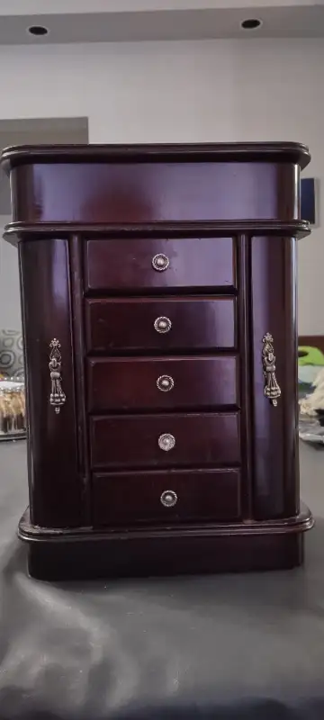 5 drawer with two sides for necklaces and bracelets jewelry box. The top opens to reveal a mirror pe...