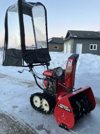 Selling a Honda 7/24 hydrostatic snowblower with cab.