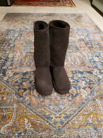 Tall Uggs. Brown suede.Size 7 worn once indoors., View more