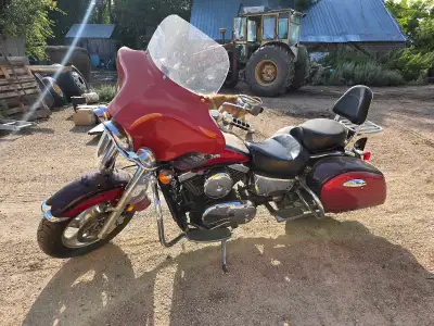 Red 1999 Kawasaki Vulcan Nomad, Black Kawasaki Vulcan Nomad. Both 1500 cc. For sale or trade.