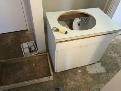 I White painted solid wood bathroom vanity with base and counter top and,white bathroom sink. I have...