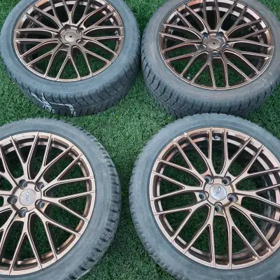 selling four18 inch Dai alloy rims with Toyo winter tires for $8500. 80% of tread remaining. tires h...