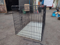 Have a large dog cage for sale,25inby32in long,black 