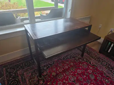 Wooden desk and office chair set priced for a quick sale of $75.00! Desk is sturdy and has a full si...