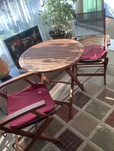 Used patio furniture in good condition. Wooden folding table and 2 folding wooden chairs.