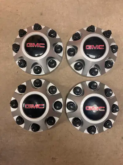 Hi selling a set of gmc sierra 2500HD centre cap with lug nuts from a 2013 3 in good condition 1 has...