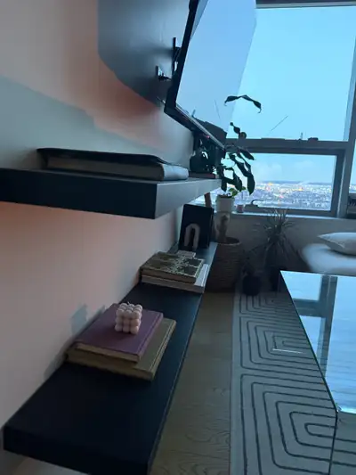 These are used floating Ikea shelves in good condition, perfect for adding a modern touch to any roo...