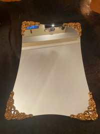 Mirror 24” by 36” with wooden gold corners.