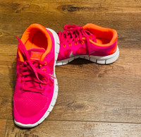 Pink, Orange, and White Nike Sneaker. 