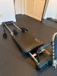 Aero Pilates reformer with additional jump board