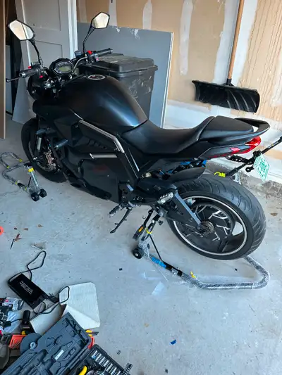 Electric motorcycle hi/low speed. DMC model. Used for a full summer, has bumpers but never dropped....