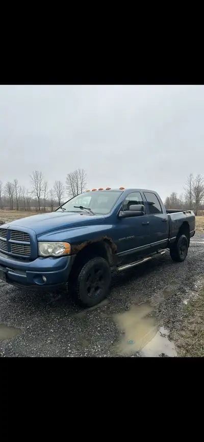Blue truck is 2004 dodge 5.9 Cummins which is now down to frame as seen in pic, other truck is a 200...