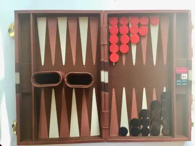 Vintage Backgammon set likely from the 1980s, housed in a brown, View more