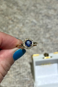 14k gold with blue sapphire surrounded by diamonds 