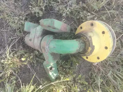 2 used steering spindles off a John Deere 9600 combine, 1 left, 1 right. complete with spindle housi...
