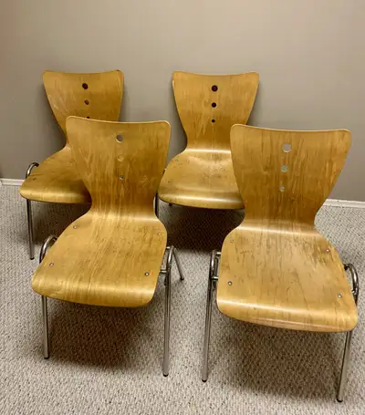 Slim, modern design, constructed of bent plywood with steel legs, these chairs are built sturdy to w...