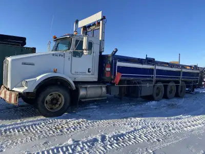 2008 T800 Triaxle Kenworth with Cassidy pipe handler. C-13 Caterpillar engine with 10,000 miles on t...