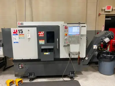 LIKE NEW Haas ST-15 CNC Lathe with good options including Auto Doors and V2 Haas Bar Feed ** Only 89...