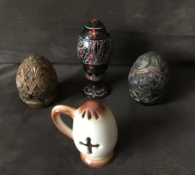 Up for sale are 5 different egg shaped items. There is a wooden Ukrainian egg box with traditional p...