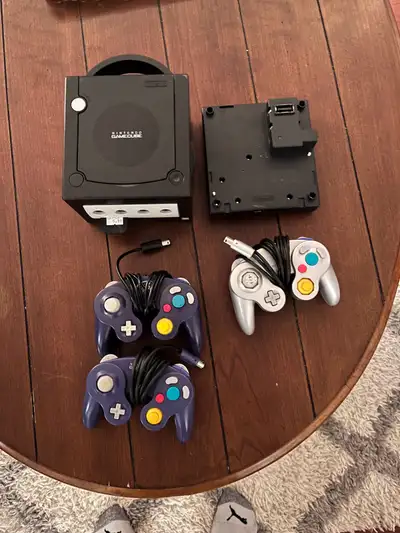 Selling a Nintendo GameCube bundle, including the console, the Gameboy Player attachment, and three...