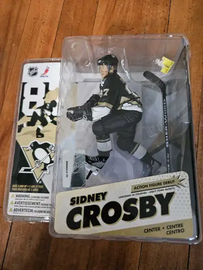 This is a Sidney Crosby McFarlane action figure, still sealed in its original packaging from NHL Ser...