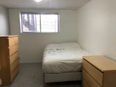 Welcome to your new house! Bedroom #4 has a comfortable double bed, a dresser, a bookshelf, and a wo...