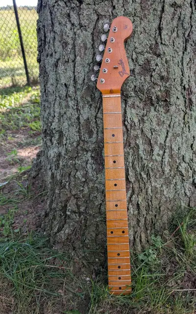 Roasted, subtly flamed "C" shape All Parts Fender Stratocaster replacement neck. Finished with an "a...